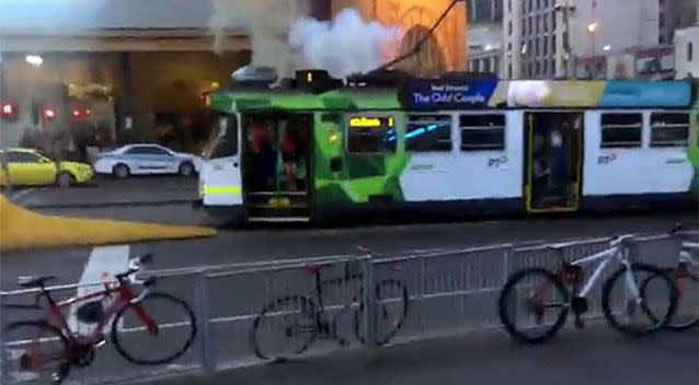 Smoke poured out of the top of the vehicle as passengers rushed to evacuate. Photo: YouTube