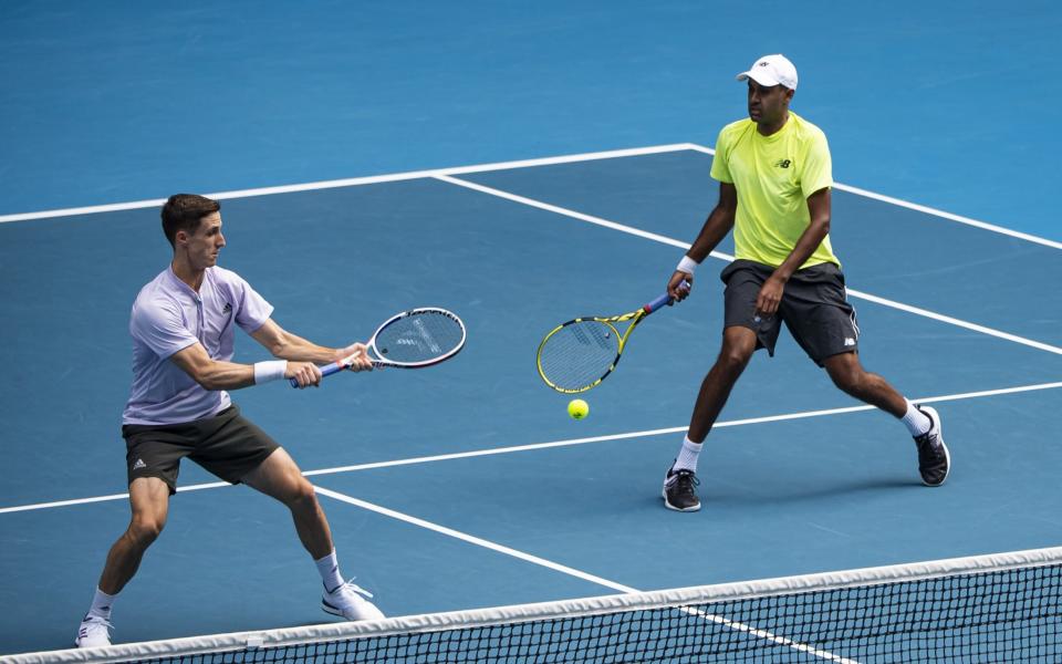 Joe Salisbury of Great Britain and Rajeev Ram of the United States in action in the men's doubles final against Luke Saville and Max Purcell of Australia on day fourteen of the 2020 Australian Open at Melbourne Park on February 02, 2020 in Melbourne, Australia - Getty Images