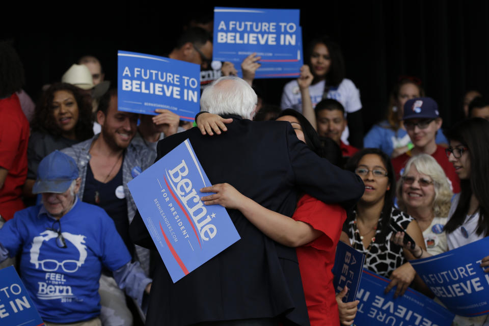 Democratic presidential candidate Sen. Bernie Sanders, I-Vt., gets a hug from a supporter at a Nevada caucus watch party in Henderson, Nev., on Saturday, Feb. 20, 2016. (Jae C. Hong/AP)