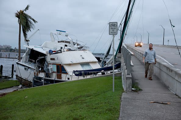 Boats are pushed up on a causeway after Hurricane Ian passed through the area on September 29, 2022, in Fort Myers, Florida.