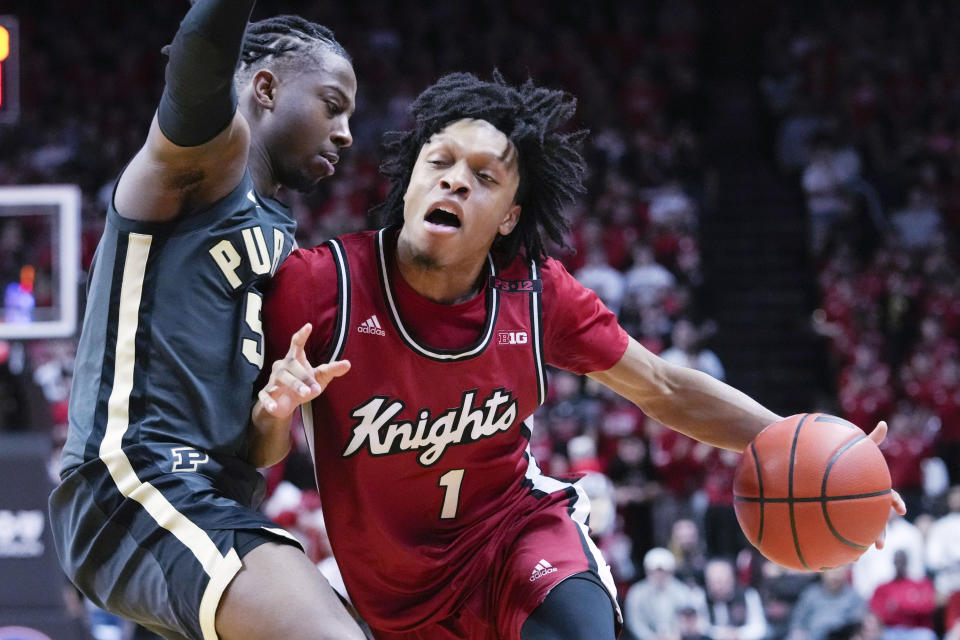 Rutgers guard Jamichael Davis (1) drives against Purdue guard Lance Jones (55) in the second half of an NCAA college basketball game, Sunday, Jan. 28, 2024, in Piscataway, N.J. Purdue won 68-60. (AP Photo/Mary Altaffer)