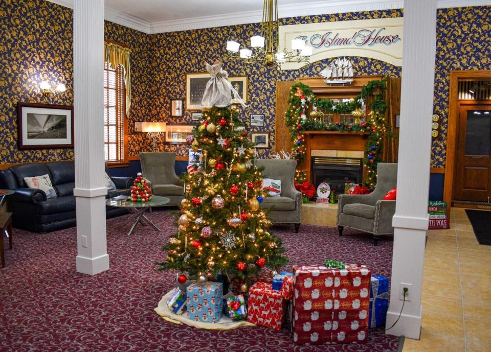 The grand lobby of The Island House Hotel is decorated for Christmas. Even after the holidays, when the tree and garland are put away, the hotel will continue to welcome visitors all winter long.