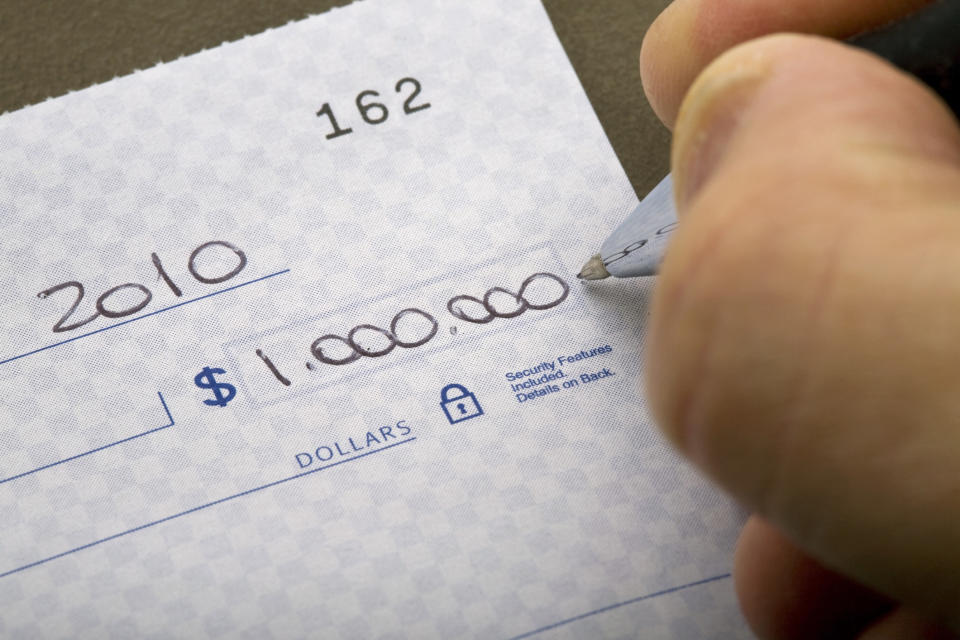 Someone writing a check for $1,000,000