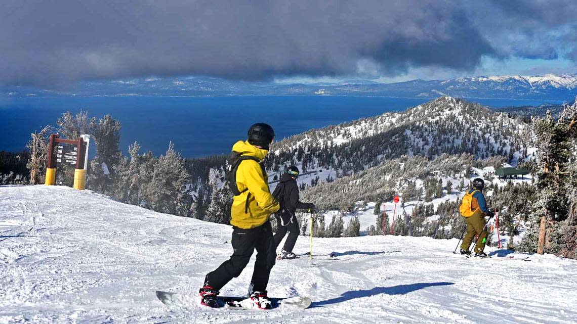Above a crystal clear view of Lake Tahoe, a snowboarder explores fresh powder Sunday at Heavenly Ski Resort. Researchers at the nearby UC Berkeley Central Sierra Snow Lab said it had received 25.6 inches of snow since Tuesday — 13.6 inches of which fell in the 24 hours ending 8 a.m. Sunday. The foothills east of Sacramento also received noticeable snow; areas east of Placerville recorded 2 to 3.5 inches in the same span. Forecasters say more snow is expected in the Sierra with rain in the Valley on Tuesday and Wednesday as another unsettled air mass moves across Northern California.