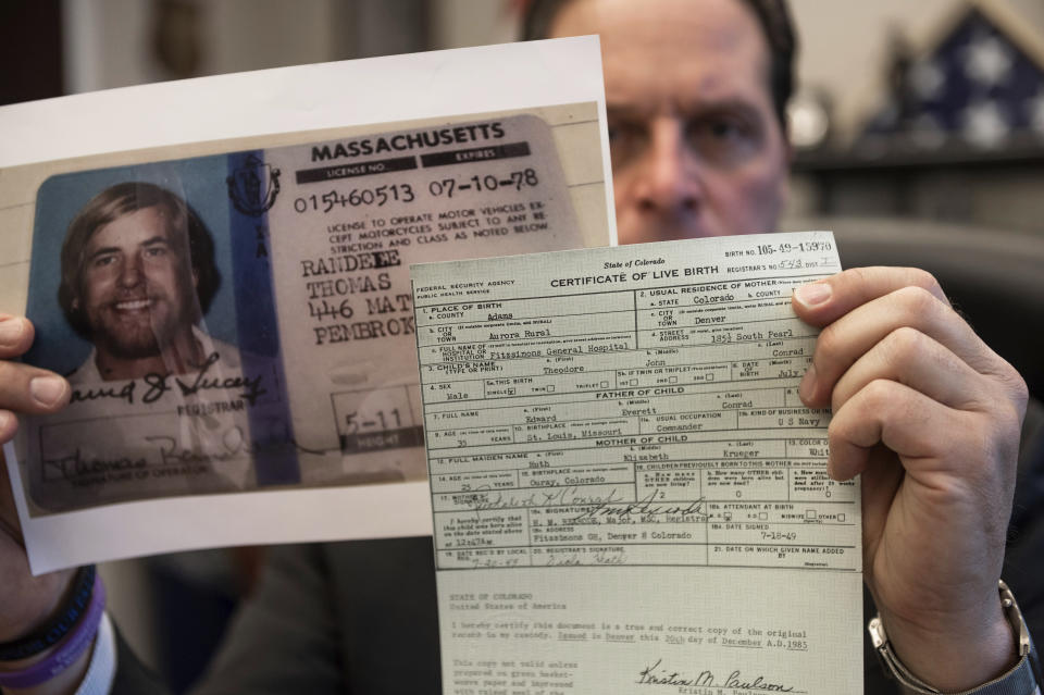 U.S. Marshal Peter J. Elliott holds the birth certificate and a copy of the driver's license of Ted Conrad on Dec. 16, 2021 at the Carl B. Stokes U.S. Courthouse in Cleveland. After more than 50 years, Elliott announced that they had closed the case on one the city's biggest bank robberies. Conrad pulled off the 1969 robbery and had been living in Boston under a new name until his death last May, Elliott said. The U.S. Marshals Service is now piecing together how he managed to create new life while evading authorities. His stunned friends in Boston say he was a devoted family man and one of the nicest and most honorable people they'd ever known. (AP Photo/Ken Blaze)