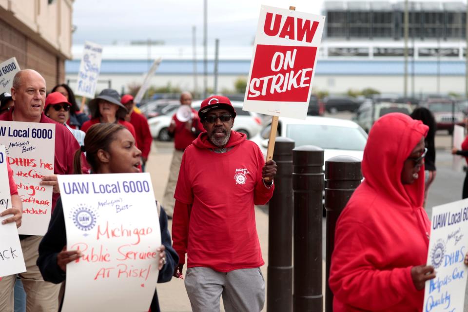 (Center) Wayman Neal, 66 of Highland Park and a Michigan Department of Health & Human Services retiree, joins others to picket in from of the DHHS office on Conner Avenue in Detroit on Wednesday, September 27, 2023. They were participating in an Informational Picket to bring more attention to their caseloads that are out of control and workers being overworked and Neal wanted to be here with them to show support.