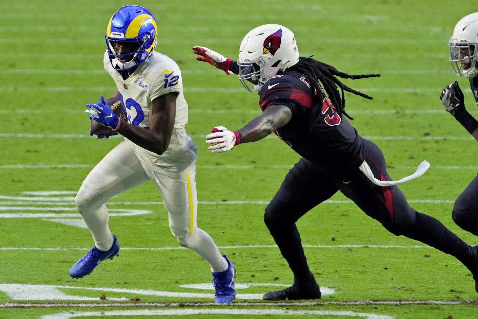 Los Angeles Rams wide receiver Van Jefferson (12) tries to elude Arizona Cardinals outside linebacker De'Vondre Campbell during the second half of an NFL football game, Sunday, Dec. 6, 2020, in Glendale, Ariz. (AP Photo/Rick Scuteri)
