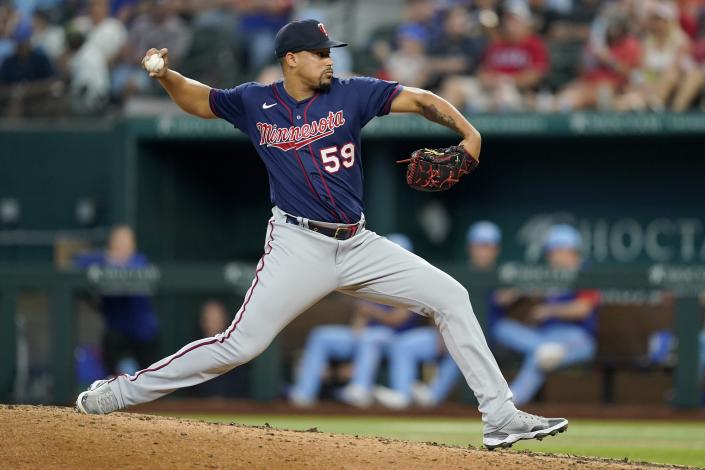 Minnesota Twins relief pitcher Jhoan Duran throws to the Texas Rangers in the eighth inning of a baseball game, Sunday, July 10, 2022, in Arlington, Texas. (AP Photo/Tony Gutierrez)