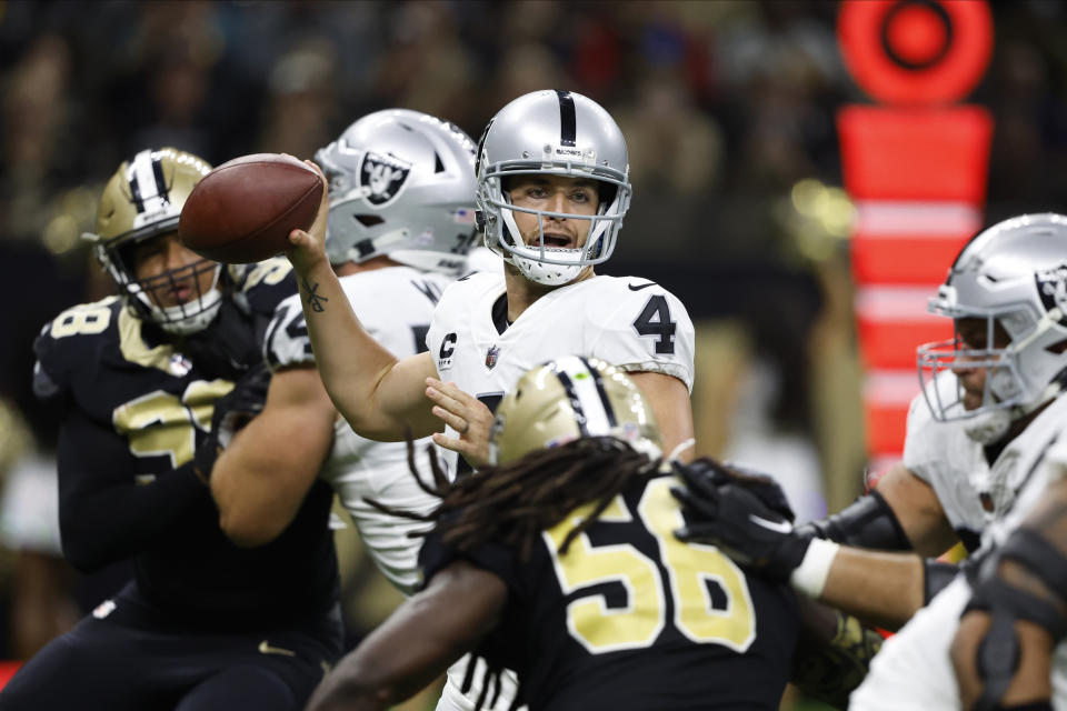 Las Vegas Raiders quarterback Derek Carr (4) passes during the second half of an NFL football game against the New Orleans Saints Sunday, Oct. 30, 2022, in New Orleans. (AP Photo/Butch Dill)