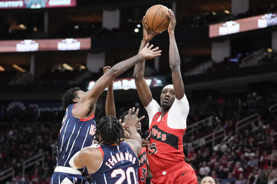 Toronto Raptors forward Chris Boucher, right, grabs a rebound from Houston Rockets forward Tari Eason, left, during the first half of an NBA basketball game, Friday, Feb. 3, 2023, in Houston. (AP Photo/Eric Christian Smith)