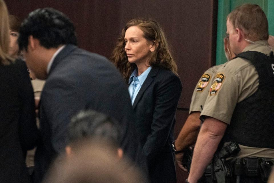 Kaitlin Armstrong enters the courtroom on Nov. 1, the first day of her murder trial. Armstrong is charged in the 2022 shooting death of pro cyclist Anna "Mo" Wilson.