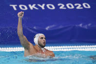 Greece's Ioannis Fountoulis celebrates after scoring a goal against the United States during a preliminary round men's water polo match at the 2020 Summer Olympics, Monday, Aug. 2, 2021, in Tokyo, Japan. (AP Photo/Mark Humphrey)