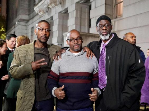 (L-R) Alfred Chesnut, Andrew Stewart and Ransom Watkins pose for a photo after being released from prison in Baltimore, Maryland, US, on 25 November 2019 after serving 36 years for a murder they did not commit. (Mid-Atlantic Innocence Pro/AFP via Getty Images)