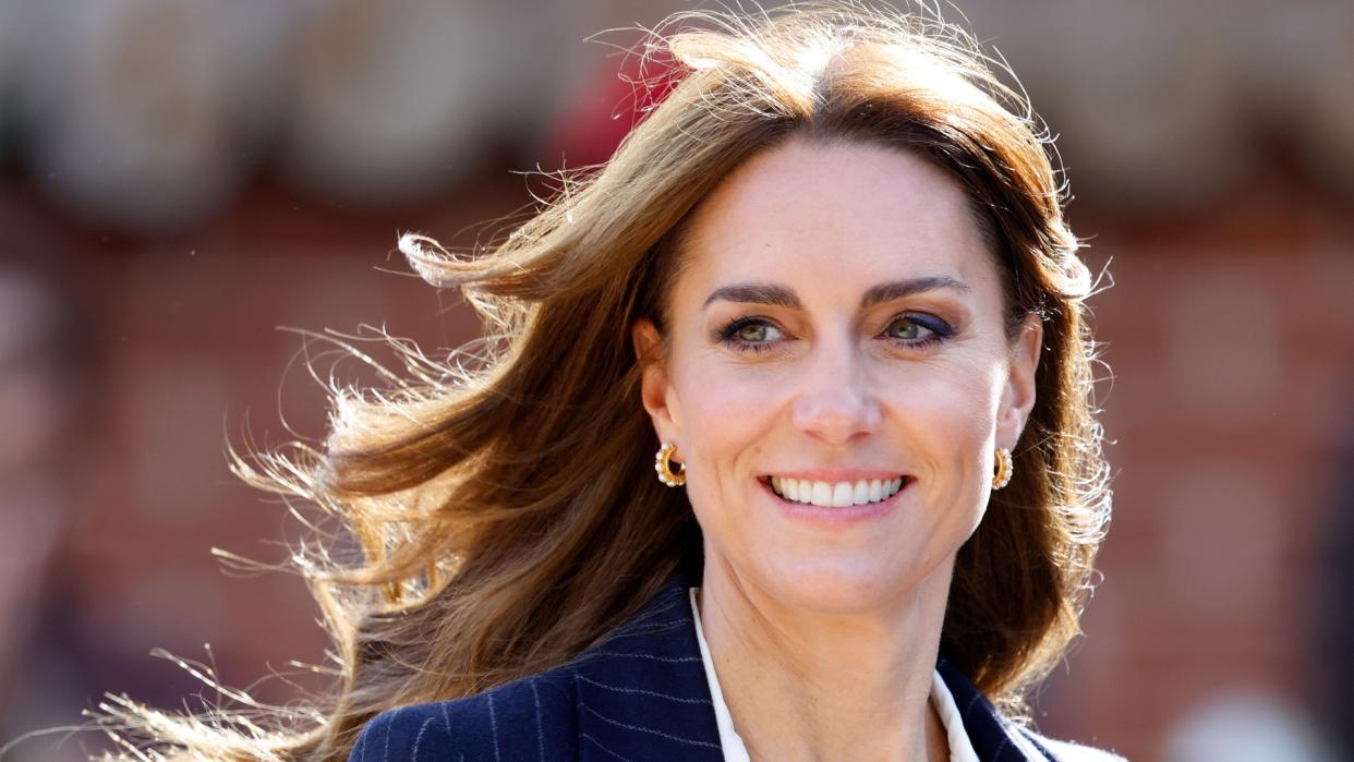  Catherine, Princess of Wales wears a pin-stripe blazer, with her hair blowing in the wind visits the Grange Pavilion to meet with members of the Windrush Cymru Elders, Black History Cymru 365 and the Ethnic Minority Youth Forum for Wales as she celebrates the beginning of Black History Month on October 3, 2023 in Cardiff, Wales. 