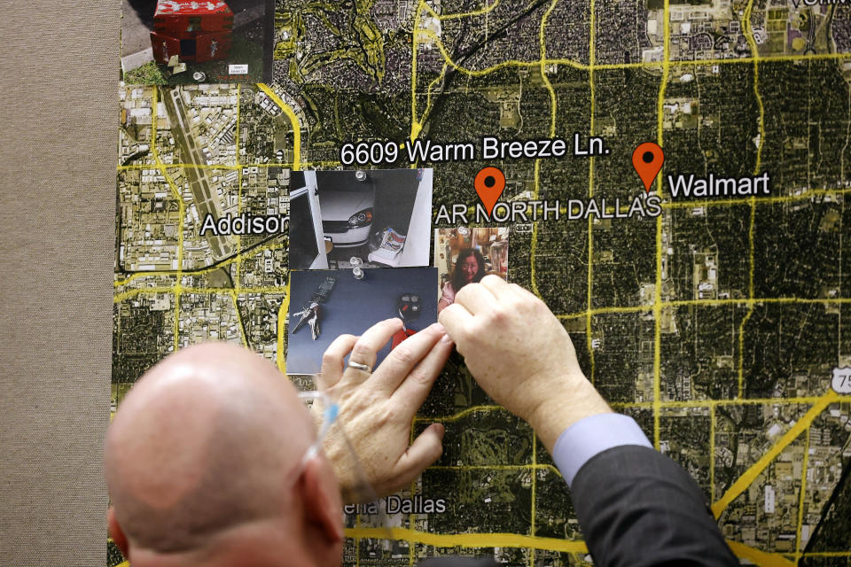 Prosecutor Glen Fitzmartin pins a photo of victim Lu Thi Harris to a map of where she resided during the murder trial of Billy Chemirmir at the Frank Crowley Courts Building in Dallas, Tuesday, Nov. 16, 2021. Chemirmir faces life in prison without parole if convicted of capital murder in the death of 81-year-old Lu Thi Harris. (Tom Fox/The Dallas Morning News via AP, Pool)