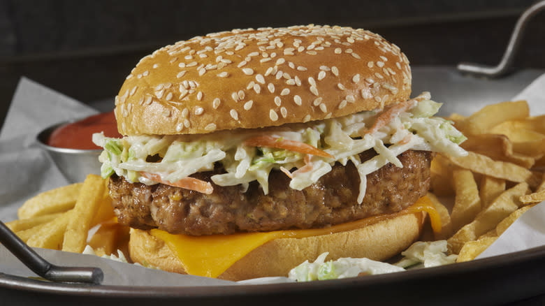 A pork burger with fries