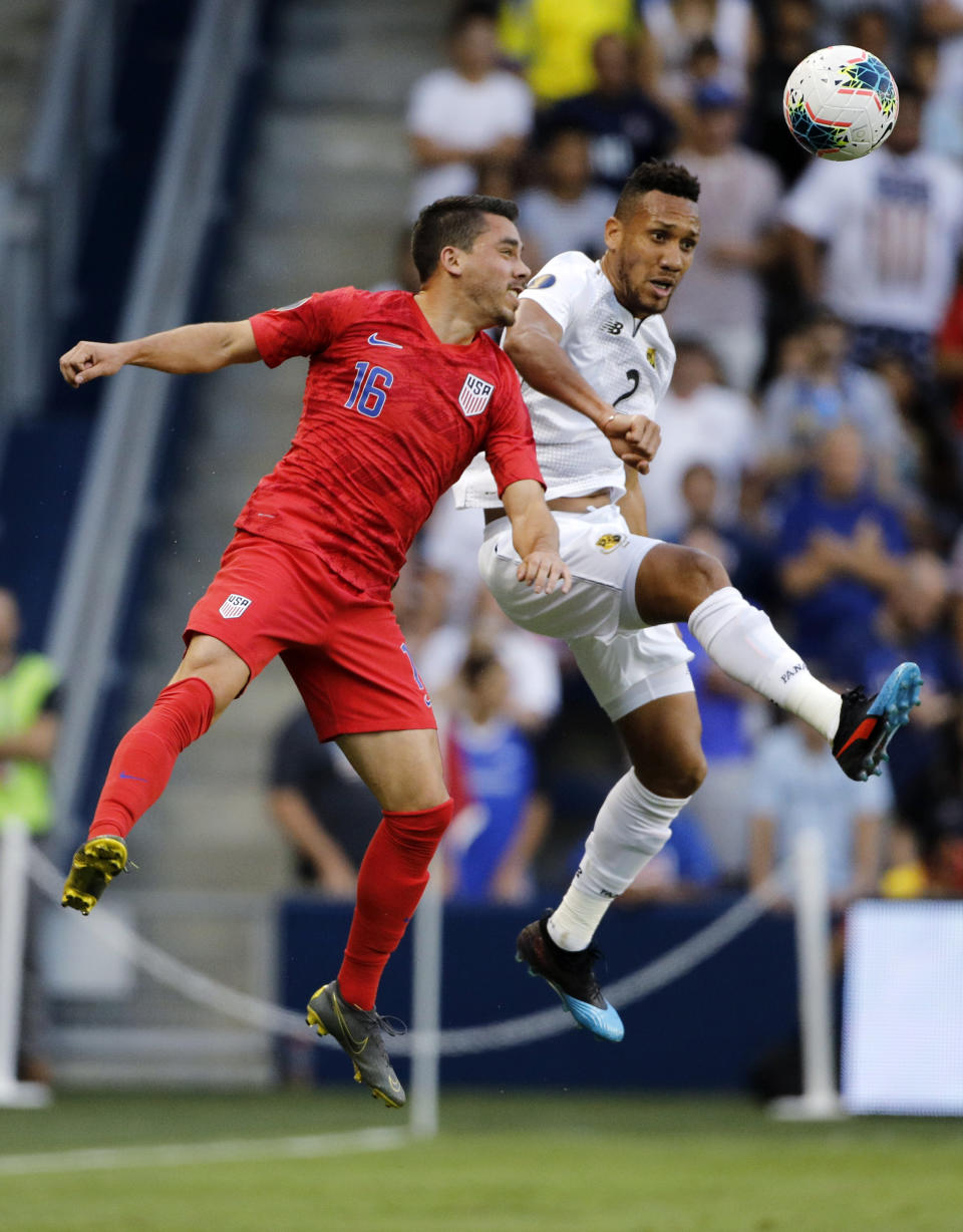 United States' Daniel Lovitz (16) and Panama' Francisco Palacios (2) go up for the ball during the first half of a CONCACAF Gold Cup soccer match in Kansas City, Kan., Wednesday, June 26, 2019. (AP Photo/Colin E. Braley)