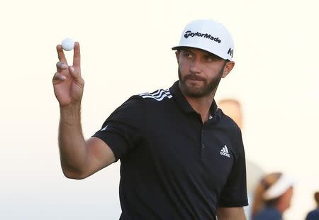 Sep 10, 2016; Carmel, IN, USA; Dustin Johnson reacts to making a birdie putt on the 18th hole during the BMW Championship at Crooked Stick GC. Brian Spurlock-USA TODAY Sports