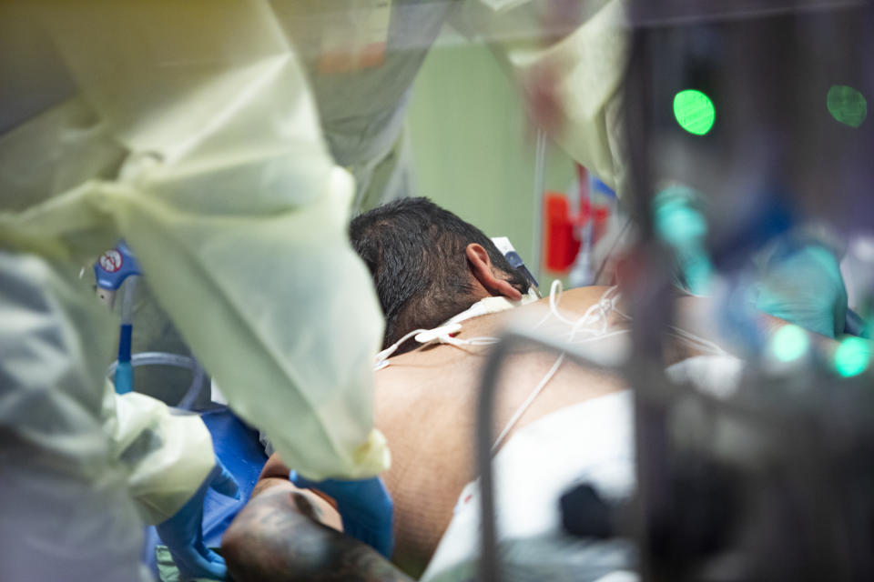 Medical professionals pronate a 39 year old unvaccinated COVID-19 patient in the Medical Intensive care unit (MICU) at St. Luke's Boise Medical Center in Boise, Idaho on Tuesday, Aug. 31, 2021. (AP Photo/Kyle Green)