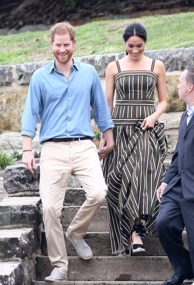 Meghan Markle and Prince Harry visited Bondi Beach in Australia on Oct. 19, 2018. She wore a black version of Castañer’s popular suede wedge espadrille. - Credit: MEGA