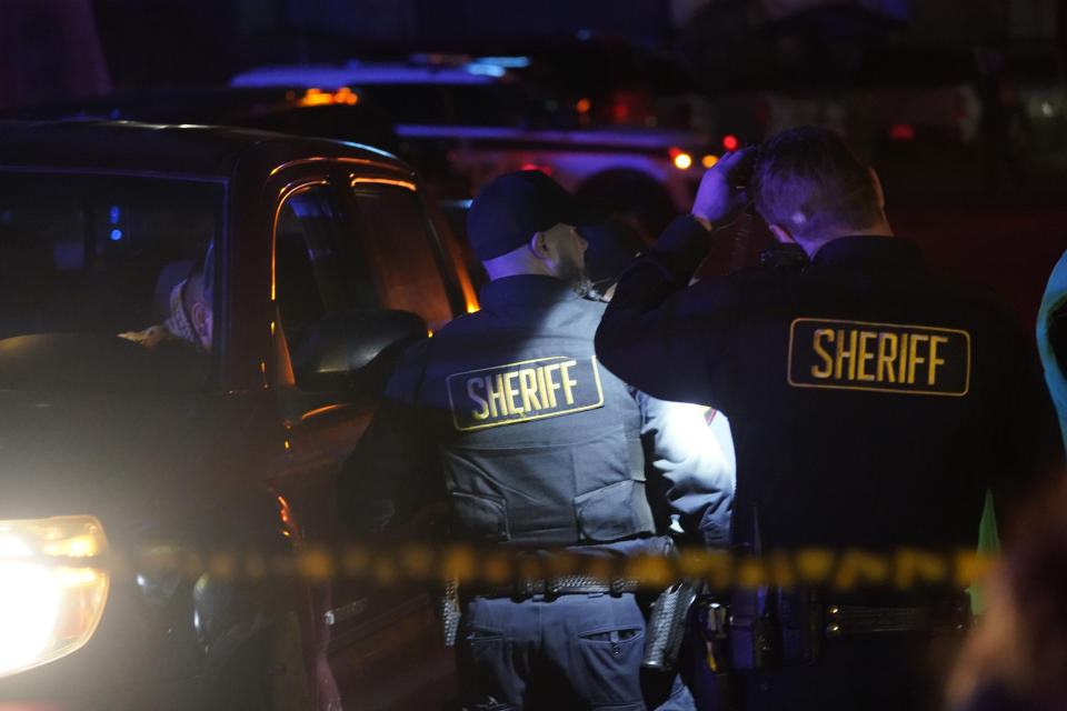 Law enforcement personnel control the scene of a shooting Monday, Jan. 23, 2023, in Half Moon Bay, Calif. Multiple people were killed in two related shootings Monday at a mushroom farm and a trucking firm in a coastal community south of San Francisco, and officials say a suspect is in custody. (AP Photo/Jeff Chiu)