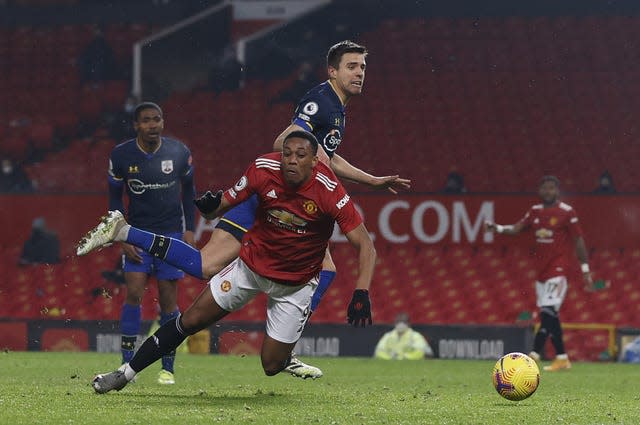 Anthony Martial goes down under Jan Bednarek's challenge