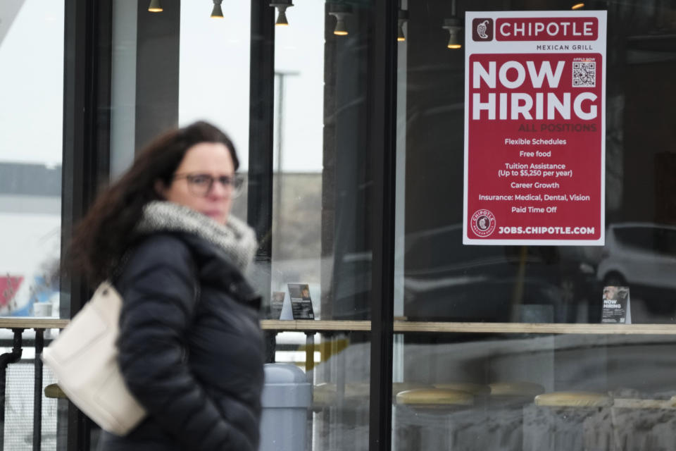 A hiring sign is displayed at a Chipotle restaurant in Schaumburg, Ill., Monday, Jan. 30, 2023. America’s employers added a robust 517,000 jobs in January, a surprisingly strong gain in the face of the Federal Reserve’s aggressive drive to slow growth and tame inflation with higher interest rates. (AP Photo/Nam Y. Huh)