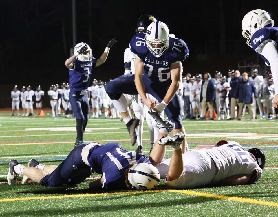 Rockland's Jacob Coulstring scores a touchdown on this play as Liam Wallace celebrates during a game versus St. Mary's at Walpole High School on Friday, Nov. 18, 2022.   