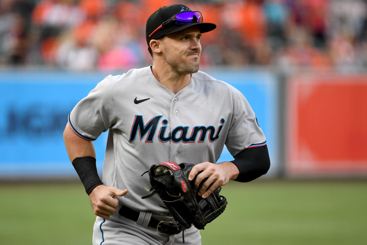 BALTIMORE, MARYLAND - JULY 27: Adam Duvall #14 of the Miami Marlins warms up prior to the game against the Baltimore Orioles at Oriole Park at Camden Yards on July 27, 2021 in Baltimore, Maryland. (Photo by Will Newton/Getty Images)