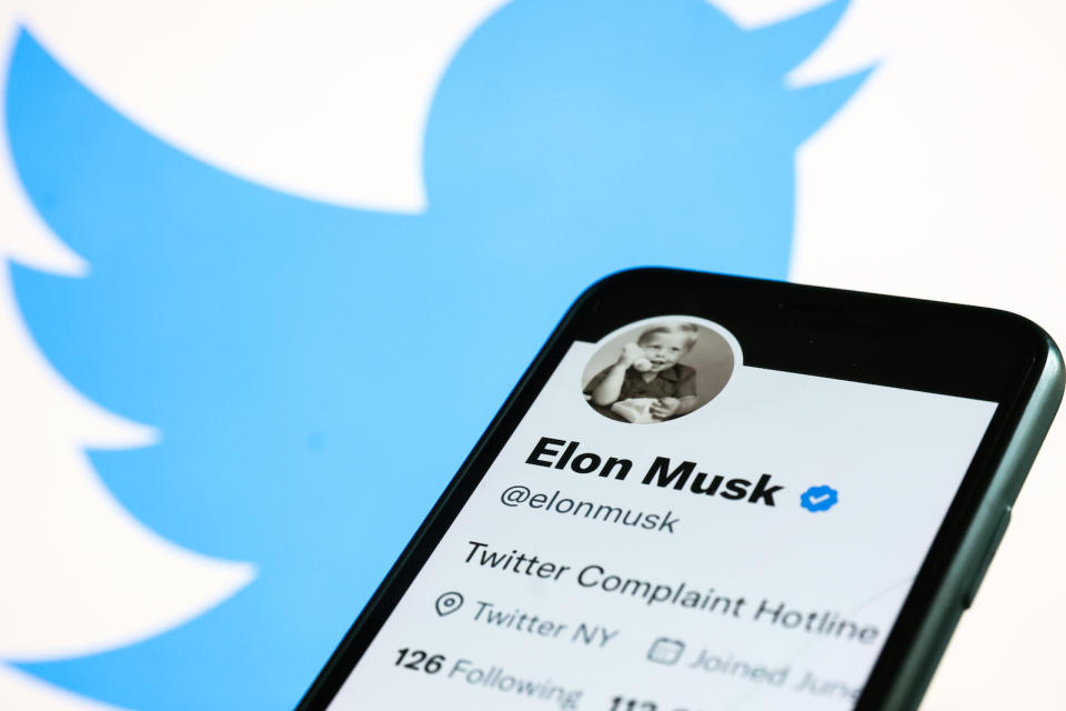 Elon Musk's Twitter account displayed on a phone screen and Twitter logo displayed on a laptop screen are seen in this illustration photo taken in Krakow, Poland on November 1, 2022. (Photo by Jakub Porzycki/NurPhoto)