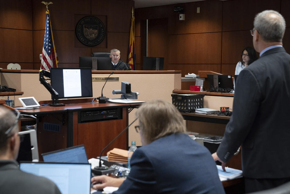 Attorneys listen to arguments during the Kari Lake election challenge trial, Wednesday, May 17, 2023, in Maricopa County Superior Court, Mesa, Ariz. Maricopa County has a failed process for verifying thousands of ballot signatures that even some of its own workers question, attorneys for Lake, the 2022 Republican candidate for Arizona governor, argued in court Wednesday. (Mark Henle/The Arizona Republic via AP, Pool)