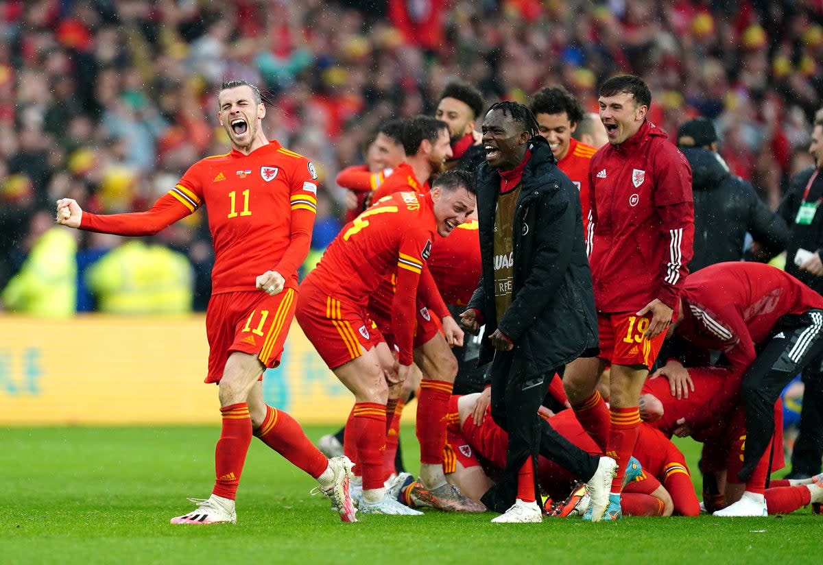 Gareth Bale, left, and Wales celebrate qualifying for the World Cup (David Davies/PA) (PA Wire)