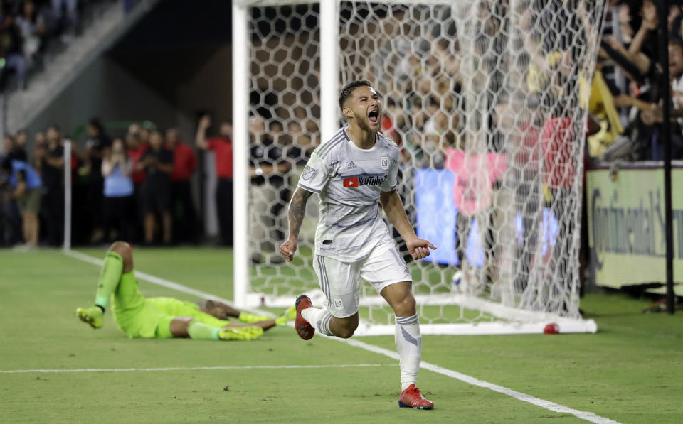 Los Angeles FC's Joshua Perez, front, celebrates his goal against San Jose Earthquakes goalkeeper Daniel Vega during the second half of an MLS soccer match Wednesday, Aug. 21, 2019, in Los Angeles. (AP Photo/Marcio Jose Sanchez)
