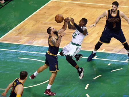 May 25, 2017; Boston, MA, USA; Boston Celtics guard Terry Rozier (12) and Cleveland Cavaliers guard Deron Williams (31) reach for a loose ball during the second quarter of game five of the Eastern conference finals of the NBA Playoffs at TD Garden. Mandatory Credit: Bob DeChiara-USA TODAY Sports