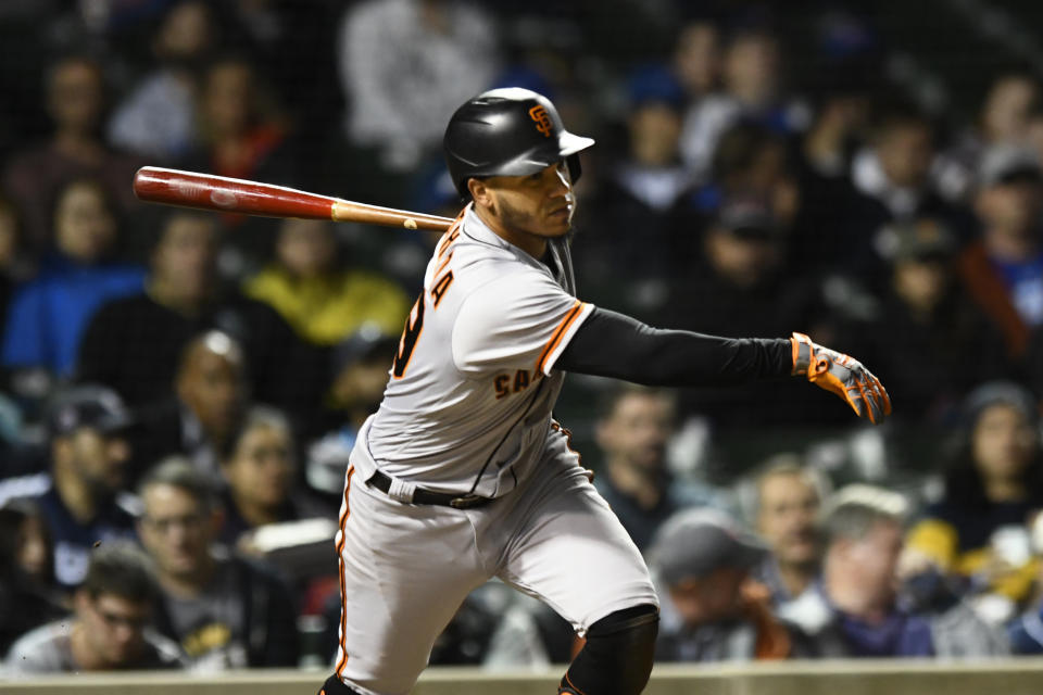 San Francisco Giants' Thairo Estrada watches his RBI single during the fourth inning of a baseball game against the Chicago Cubs, Sunday, Sept. 11, 2022, in Chicago. (AP Photo/Paul Beaty)