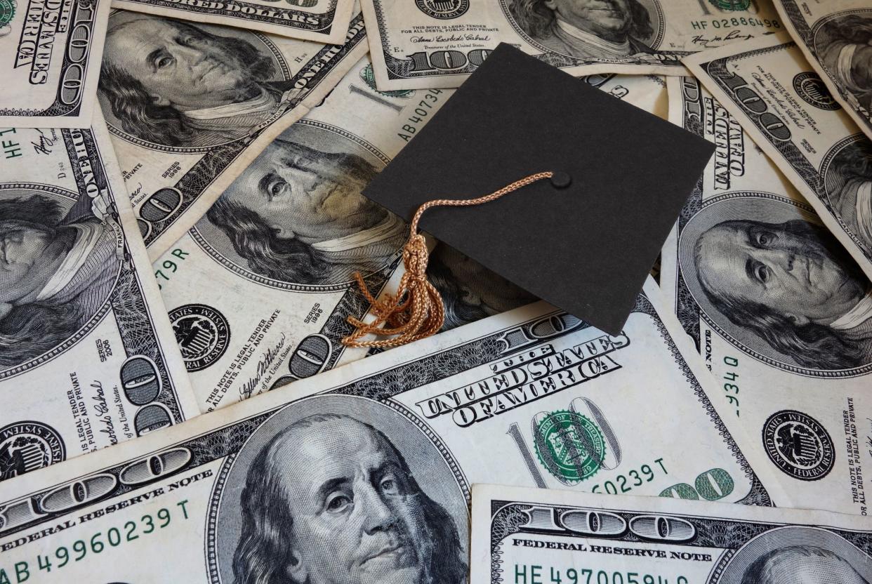 Miniature graduation cap on assorted cash