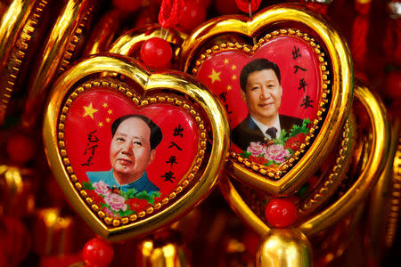 Souvenirs featuring portraits of China's late Chairman Mao Zedong and China's President Xi Jinping are seen at a shop near the Forbidden City in Beijing, China, September 9, 2016. REUTERS/Thomas Peter