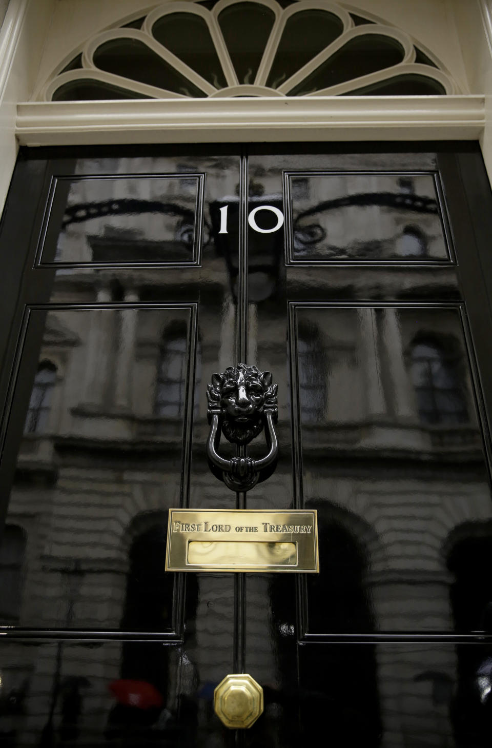 FILE - In this file photo dated Friday, June 7, 2019, a view of the front door to the official residence of Britain's Prime Minister in central London, 10 Downing Street. Lawmakers are set to narrow the field of contenders for leadership of the Conservative Party and Prime Minister, in a series of elimination votes over the coming days, with the final two names put to a vote of Conservative party members nationwide. The six contenders to replace Prime Minister Theresa May are: Michael Gove, Jeremy Hunt, Sajid Javid, Boris Johnson, Dominic Raab, Rory Stewart. (AP Photo/Matt Dunham, FILE)