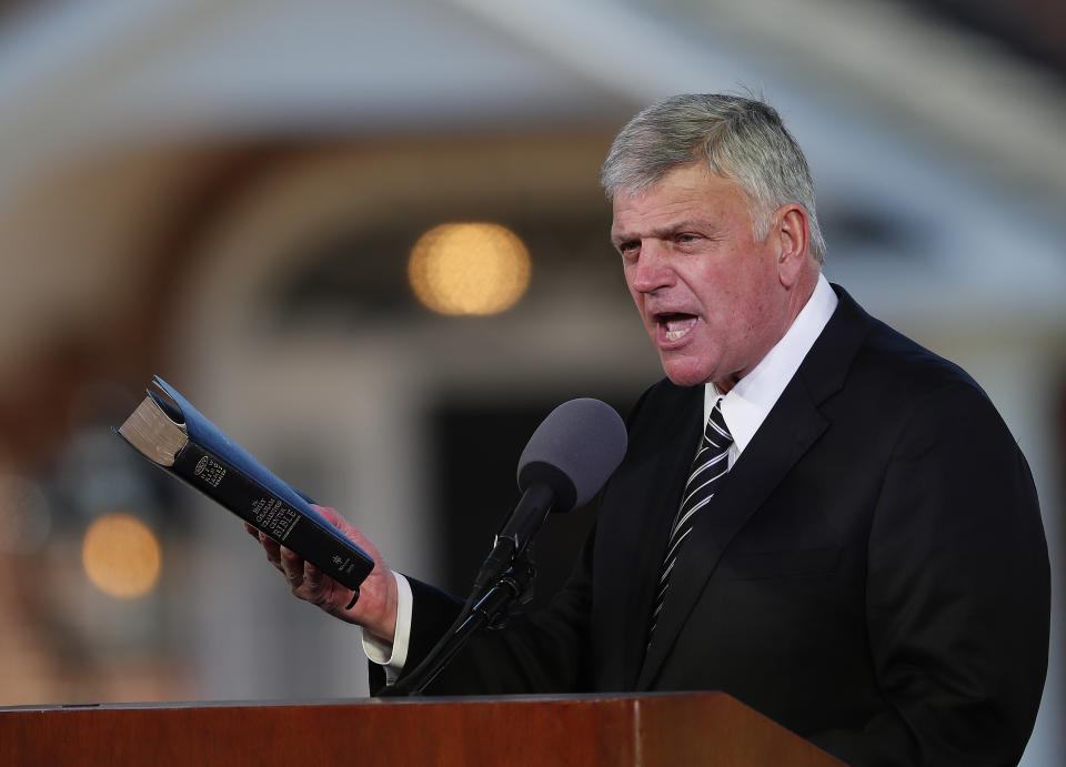 FILE - In this March 2, 2018 file photo, Pastor Franklin Graham speaks during a funeral service at the Billy Graham Library for the Rev. Billy Graham, who died last week at age 99 in Charlotte, N.C. Graham has denounced the impeachment investigation of President Donald Trump, but this week asked followers to “pray w/me” that Trump would reconsider his ceding of Syrian territory to Turkey. (AP Photo/John Bazemore, File)