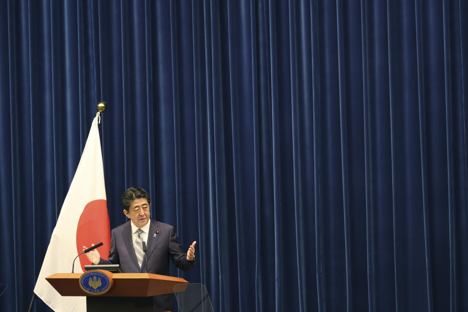 Japanese Prime Minister Shinzo Abe speaks during a press conference in Tokyo, Monday, Dec. 9, 2019. Abe said his country is arranging Iranian President Hassan Rouhani's visit to Japan as the country seeks to play a greater role in relieving tension in the Middle East where Japanese oil imports mainly come from. (AP Photo/Koji Sasahara)