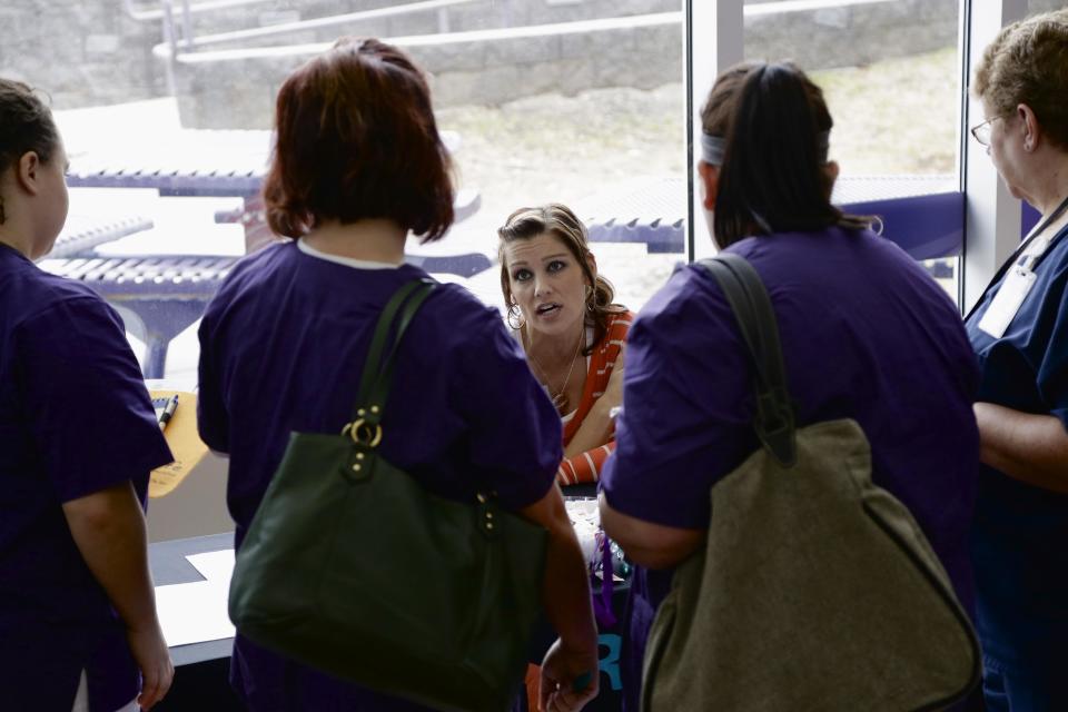 In this April 10, 2014 photo, Jennifer Stickney, a recruiter for Right at Home, which provides in-home care and assistance, answers questions from nursing students at a job fair on the campus of Kaplan University in Lincoln, Neb. The Labor Department on Friday, May 2, 2014 said U.S. employers added a robust 288,000 jobs in April, the most in two years, the strongest evidence to date that the economy is picking up after a brutal winter slowed growth. (AP Photo/Nati Harnik)