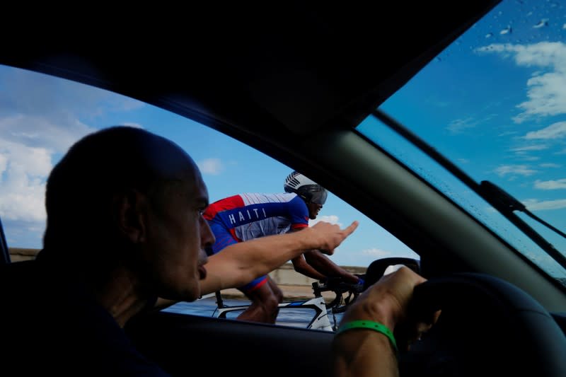 The Wider Image: Haiti's cyclists brave protests and poor roads in race for gold