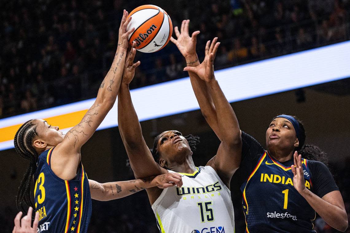 Indiana Fever guard Leilani Correa (23) and forward NaLyssa Smith (1) go up for the rebound with Dallas Wings center Teaira McCowan (15) in the third quarter of a WNBA preseason game between the Dallas Wings and Indiana Fever at College Park Center in Arlington on Friday, May 3, 2024.