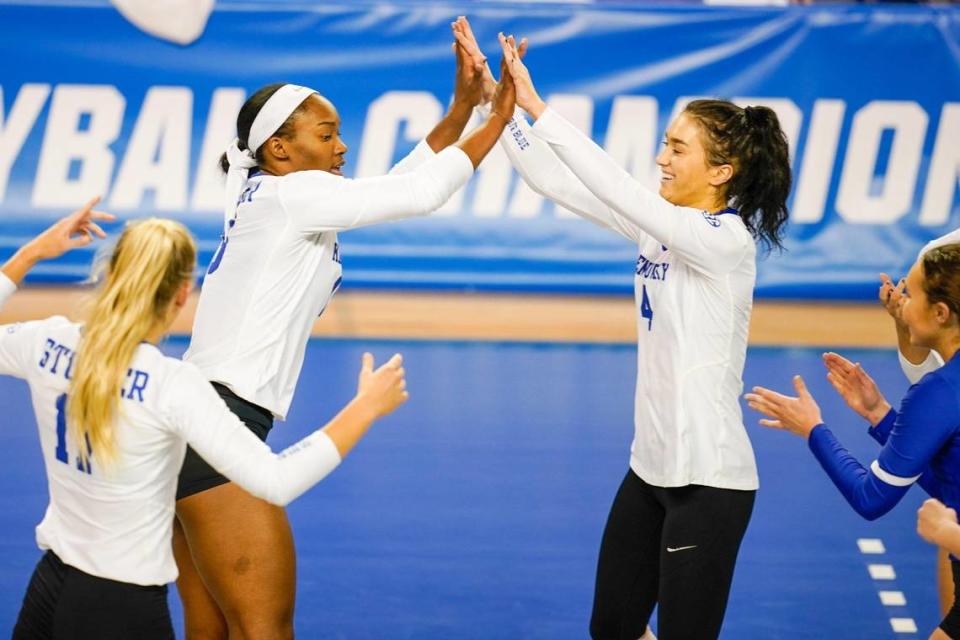 Kentucky’s Azhani Tealer, left, and Emma Grome, right, celebrate during the Wildcats’ NCAA Tournament-opening win in Memorial Coliseum on Friday night.