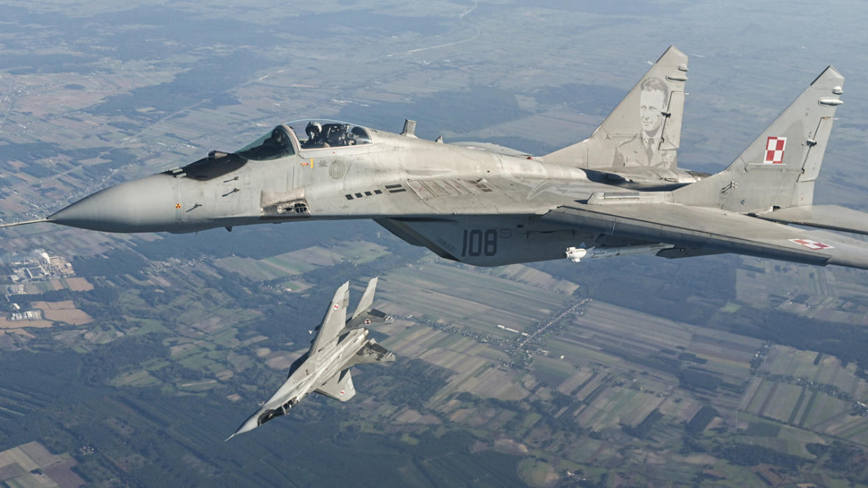 A Raftor F22 from US Air Force, F 16 fighter jets and MiG-29 from the Polish Air Force in the air.