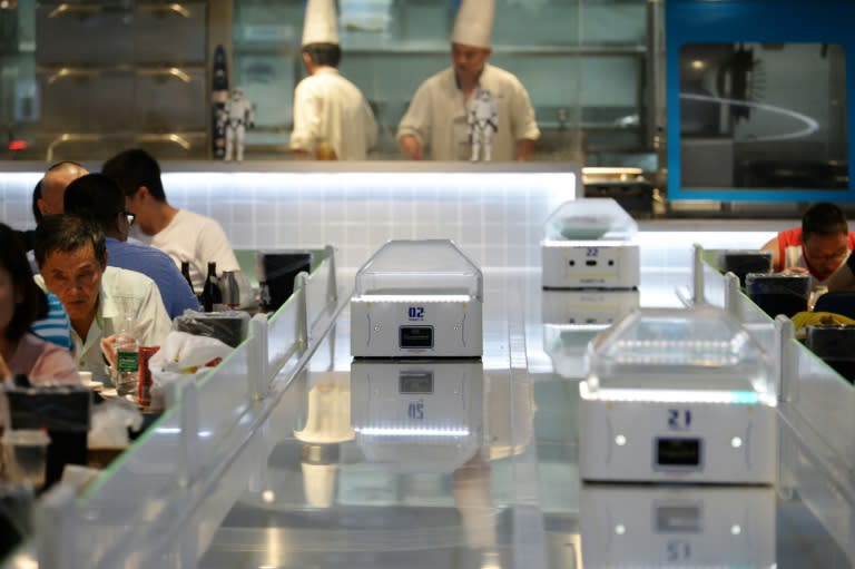 El restaurante Robot.Hede Shanghai, donde los camareros han sido sustituidos por máquinas, es solo un ejemplo de hacia donde camina China desde el punto de vista del empleo. Foto: AFP.