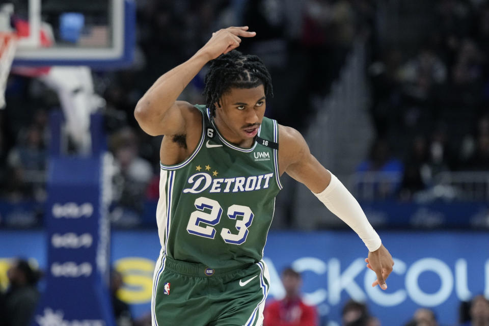 Detroit Pistons guard Jaden Ivey reacts after a three-point basket during the second half of an NBA basketball game against the New York Knicks, Sunday, Jan. 15, 2023, in Detroit. (AP Photo/Carlos Osorio)