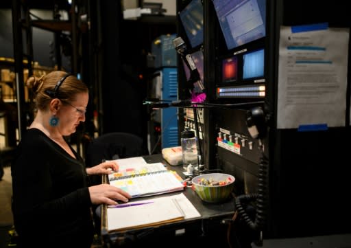 Stage manager Lynn Krynicki calls the show from her post backstage; each WNO performance of 'Tosca' involves some 217 staff, including 96 stage performers, 66 musicians in the pit and another seven backstage