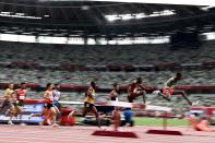 <p>(From R) Ethiopia's Lamecha Girma, Kenya's Benjamin Kigen, France's Djilali Bedrani and Uganda's Albert Chemutai compete in the men's 3000m steeplechase heats during the Tokyo 2020 Olympic Games at the Olympic Stadium in Tokyo on July 30, 2021. (Photo by Jewel SAMAD / AFP)</p> 