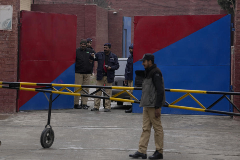 Police officers stand guard outside the Adiyala prison, where a special court proceeding going on for a case against Pakistan's former Prime Minister Imran Khan, in Rawalpindi, Pakistan, Tuesday, Jan. 30, 2024. A Pakistani court on Tuesday sentenced former Prime Minister Khan and one of his party deputy to 10 years in prison each, after finding them guilty of revealing official secrets. (AP Photo/Anjum Naveed)